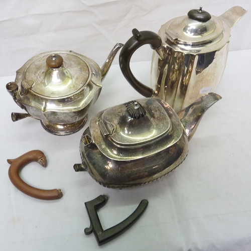 5 - A silver hot water jug, a/f spout split on seam; two silver teapots, handles damaged and detached bu... 