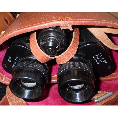 304 - Two pairs of binoculars, two cameras and a small tripod