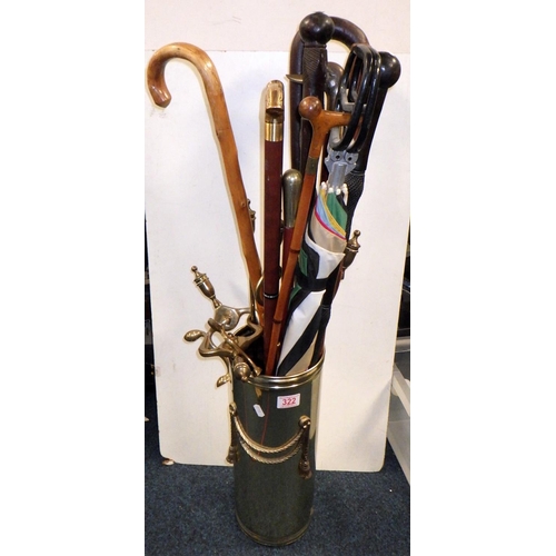 322 - A brass stick stand and sticks together with brass fire dogs etc