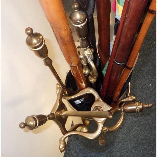 322 - A brass stick stand and sticks together with brass fire dogs etc