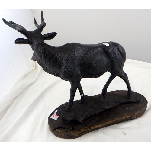 343 - A cast metal figure of a stag on a wooden base af