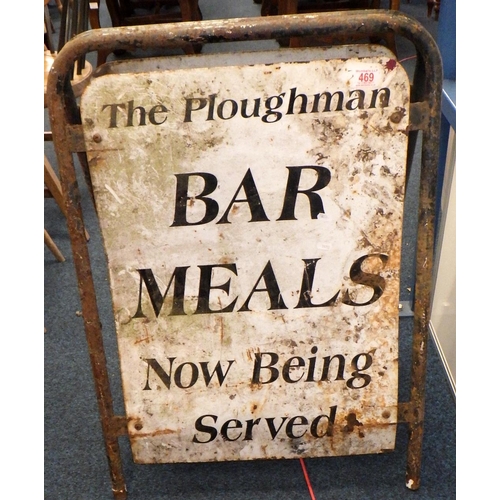 469 - A two sided standing metal sign for: The Ploughman Bar Meals. Very rusted.