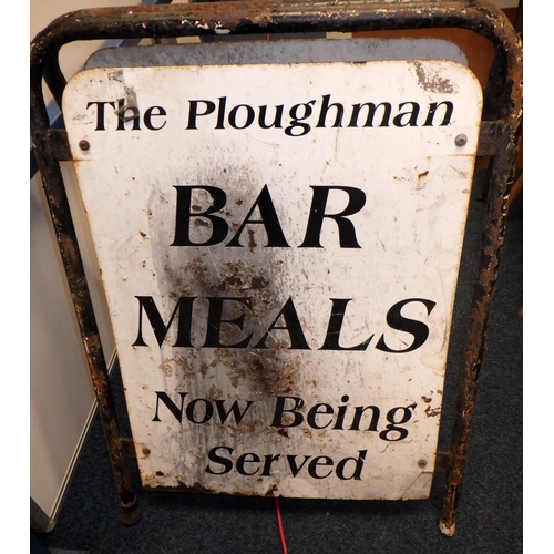 469 - A two sided standing metal sign for: The Ploughman Bar Meals. Very rusted.