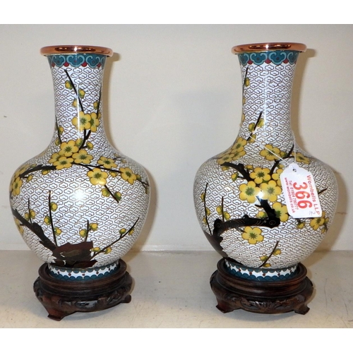 366 - A pair of cloisonne vases on wooden stands