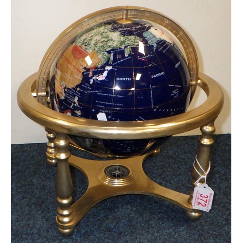 372 - A table top globe on metal stand 45cm tall