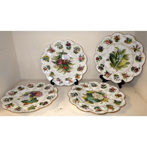 375 - A group of seven matching floral decorated plates.