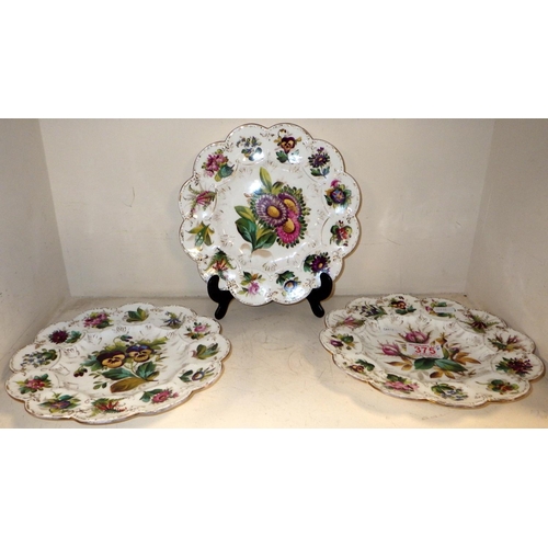 375 - A group of seven matching floral decorated plates.