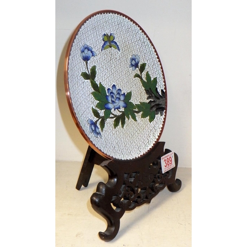 389 - A cloisonne plate on wooden stand together with a pair of small cloisonne dishes (3)