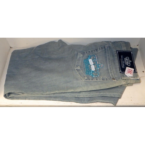 393 - A pair of Victoria Beckham / Rock & Republic womens' boot cut low rise stonewash denim jeans having ... 