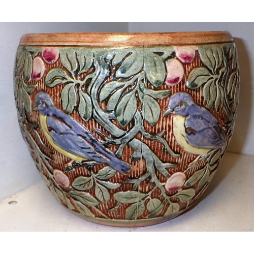 400 - A fulper  pot decorated with birds and foliage stamped Weller on base.