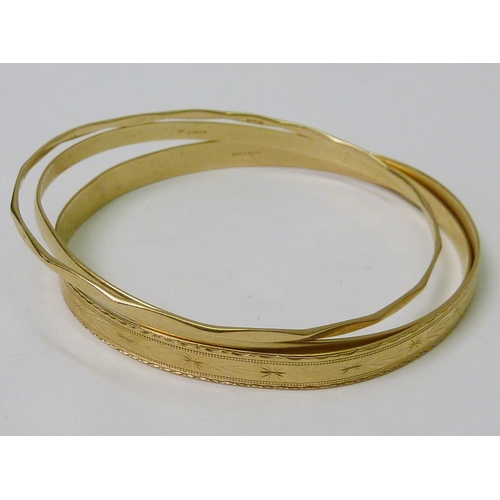76 - Three 9ct gold bangles.  Approximately 20g