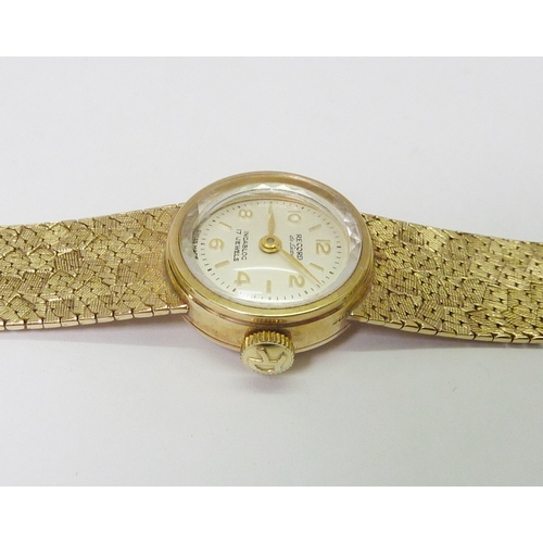 87 - A Record ladies bracelet wristwatch having a manual wind movement in a 9ct gold case on an integral ... 