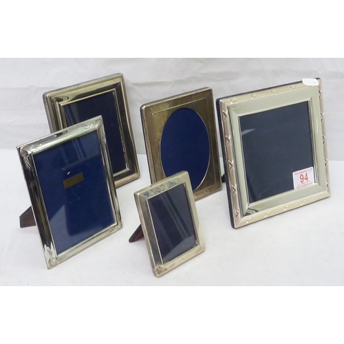 94 - Five various photograph frames, modern.  The square example 120 x 120mm aperture.  The oval aperture... 