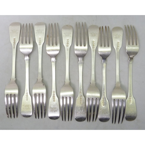 16 - Nine matching George III silver fiddle pattern table forks, Edward Middlecott, London 1817, each 197... 