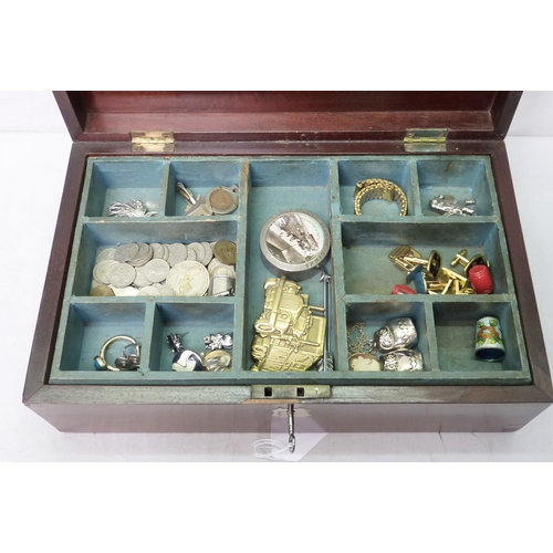 141 - A collectors' lot including coins, cufflinks, a clay smokers' pipe, the group contained in a Victori... 