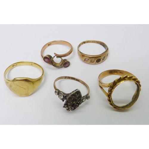 48 - A gold signet ring, Birmingham assay marked rubbed; a 9ct gold stone set ring; three various rings, ... 