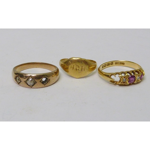 49 - Two 18ct gold rings, 5g gross; an unmarked yellow metal example.  All a/f. (3)