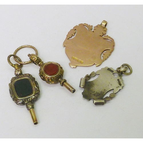52 - A 9ct gold watch fob, 10g; a silver watch fob; two stone-set watch key fobs.  (4)