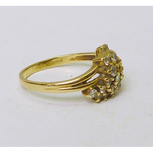 53 - An 18ct gold diamond cluster ring, three stones lacking.  2.5g gross