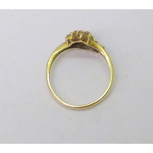 53 - An 18ct gold diamond cluster ring, three stones lacking.  2.5g gross