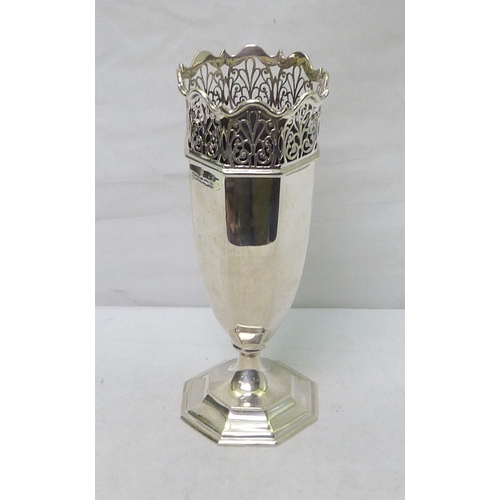 97 - A silver octagonal vase having a pierced waved rim, Sheffield 1925.  A/F bruised.   260mm tall / 395... 