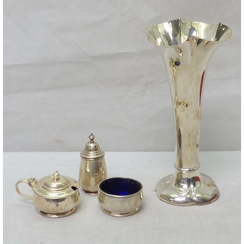 99 - A three piece cruet set, silver early 20th cent; a silver vase, last a/f.  78g weighable.