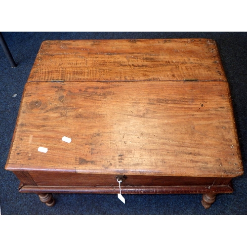 23 - An Indian hardwood table top desk and a carved pine panel (2)