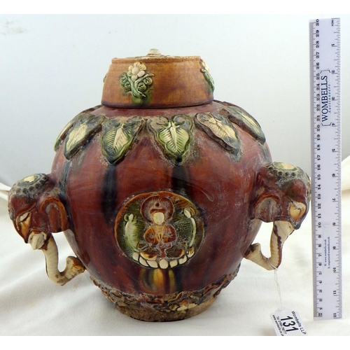 131 - An Oriental lidded vase decorated with elephants and figures 30cm tall