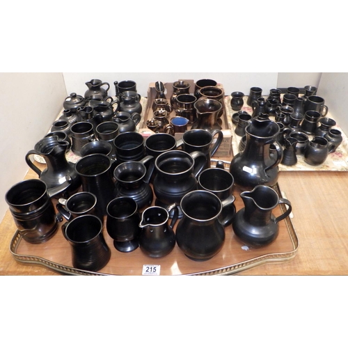 215 - A large collection of Art pottery jugs etc to inc Prinknash (4)