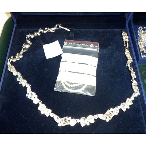 302 - Swarovski Crystal jewellery: a white metal set necklace, a crystal bead necklace, two tennis bracele... 