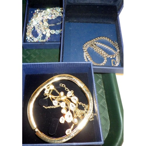 302 - Swarovski Crystal jewellery: a white metal set necklace, a crystal bead necklace, two tennis bracele... 