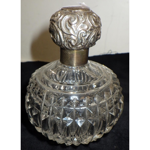 333 - A late Victorian scent bottle, cut glass with a screw-on silver lid, stopper lacking, 100mm tall; a ... 