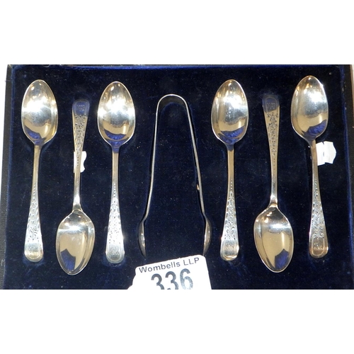 336 - A cased set of six silver coffee spoons with matching tongs. 65g