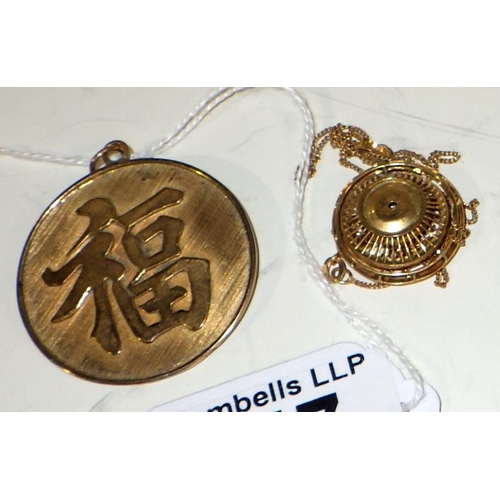 347 - A yellow metal stamped 14k Oriental pendant together with a 585 chain and pendant, total weight 15g,