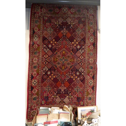 295 - A Red ground rug 130cm x 220cm