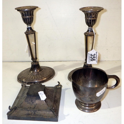 356 - A pair of silver candlesticks together with a silver ink well, cigarette box and a silver cup