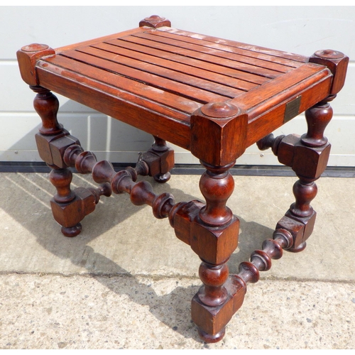 820 - A teak stool, with plaque, 