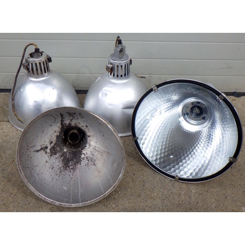 829 - Three aluminium lamp shades, 56cm tall  and another similar (4)