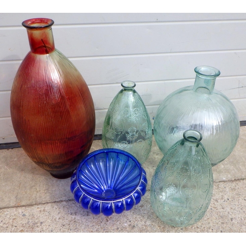 835 - Four large glass bottles and a dish (5)