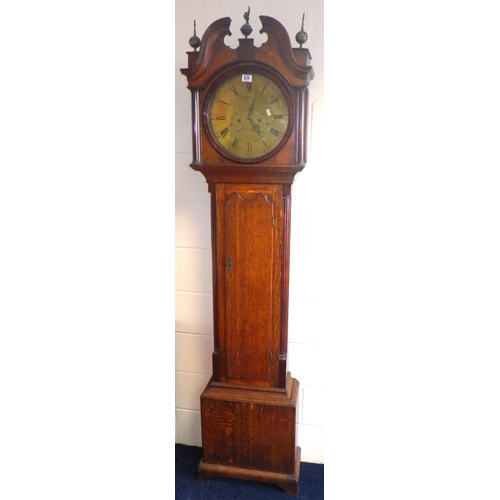 An oak longcase clock with eight day movement and circular brass face, Sam Hill, Sheffield
