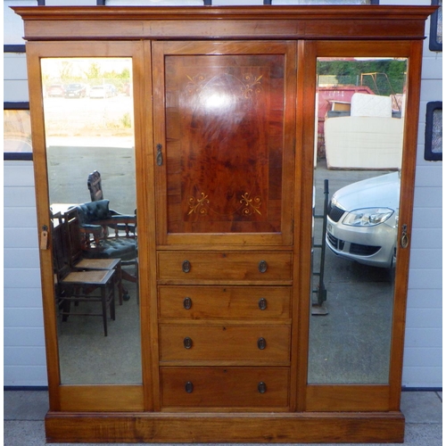 756 - An Edwardian mahogany and inlaid triple wardrobe with central doors and mirrored pin doors, missing ... 