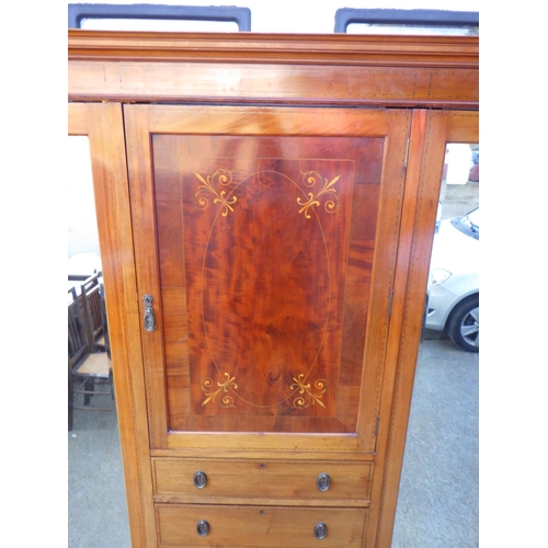 756 - An Edwardian mahogany and inlaid triple wardrobe with central doors and mirrored pin doors, missing ... 