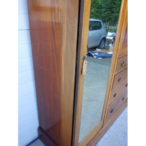 756 - An Edwardian mahogany and inlaid triple wardrobe with central doors and mirrored pin doors, missing ... 