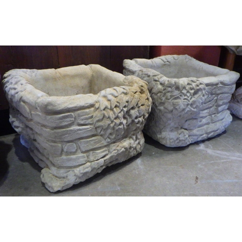 764 - A pair of concrete simulated brick & ivy garden planters 28cm tall