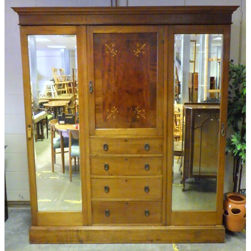 756 - An Edwardian mahogany and inlaid triple wardrobe with central doors and mirrored pin doors, missing ... 