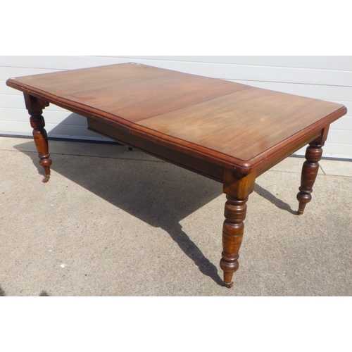 781 - A Victorian walnut wind out dining table with one leaf, missing handle (a/f)