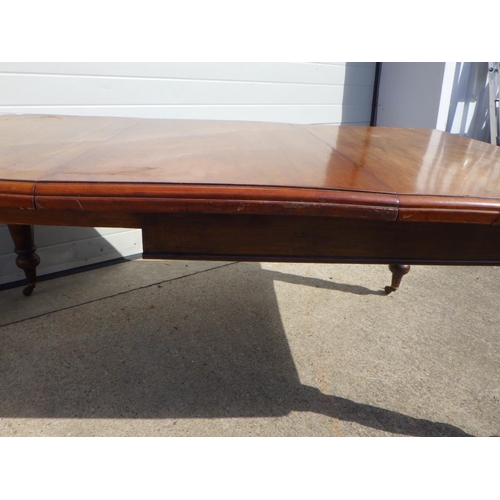 781 - A Victorian walnut wind out dining table with one leaf, missing handle (a/f)