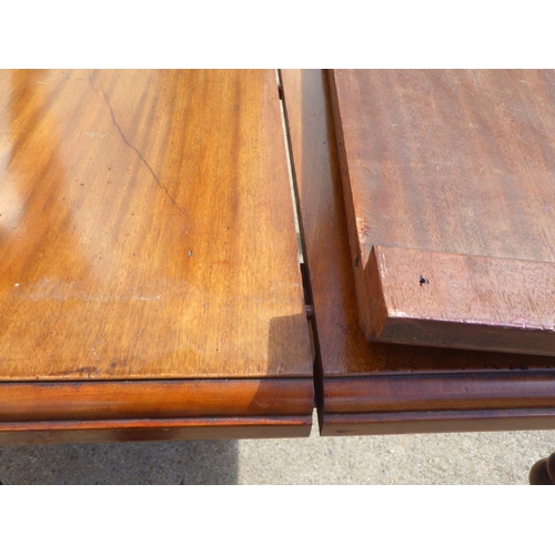 781 - A Victorian walnut wind out dining table with one leaf, missing handle (a/f)