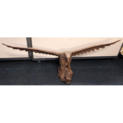 115 - A wooden eagle sculpture with a 1.22m wing span together with a large wooden box and another carving... 