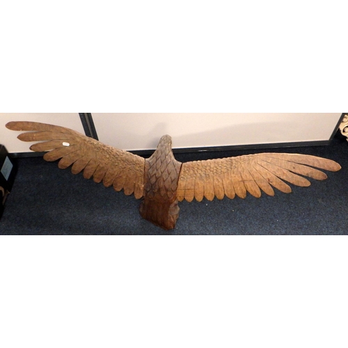 115 - A wooden eagle sculpture with a 1.22m wing span together with a large wooden box and another carving... 